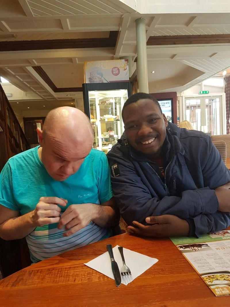 Two men spending time together at a table